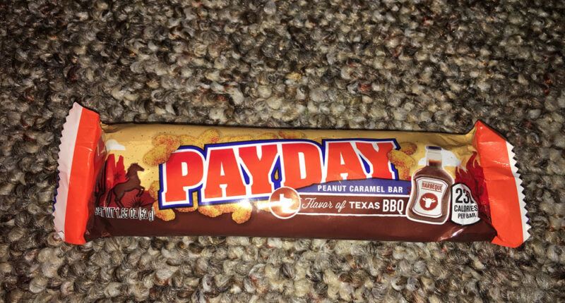 A BBQ PayDay candy bar on carpet
