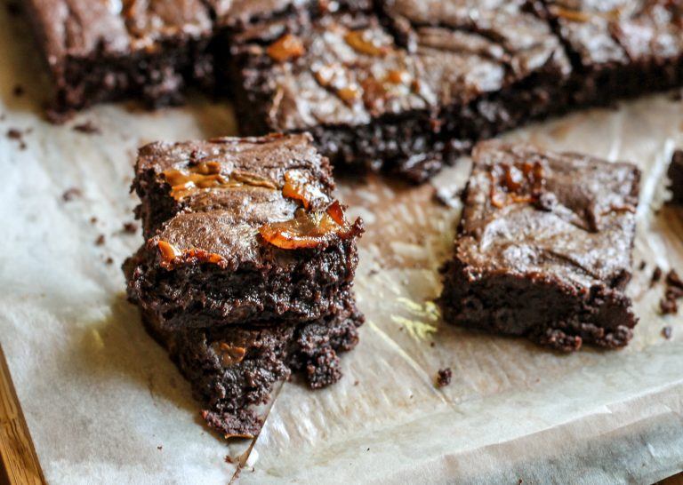 Parchment paper with cooked bacon caramel brownies from Bakerita