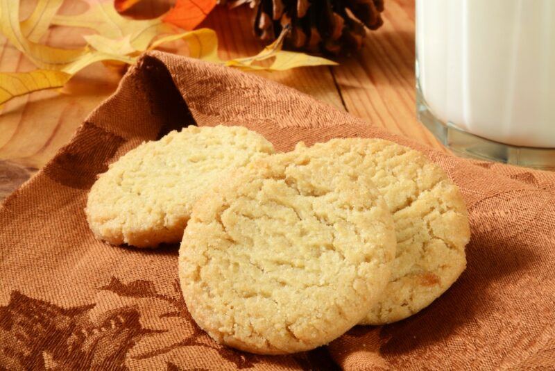 A wooden table with cookies that are similar to Ball Drop cookies