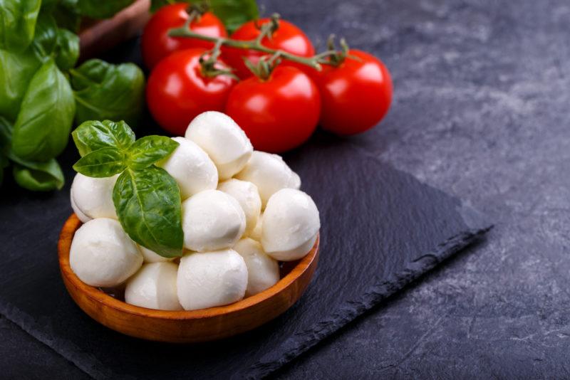 Balls of mozzerella cheese on a black table