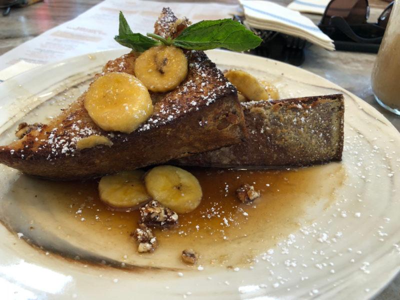 Two chunks of French toast with banana foster