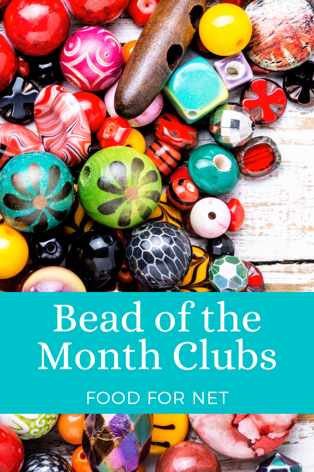 A colorful selection of beads on a white wooden table