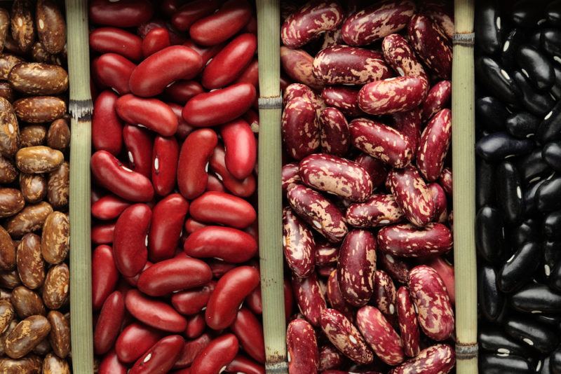 Wooden containers containing different types of beans