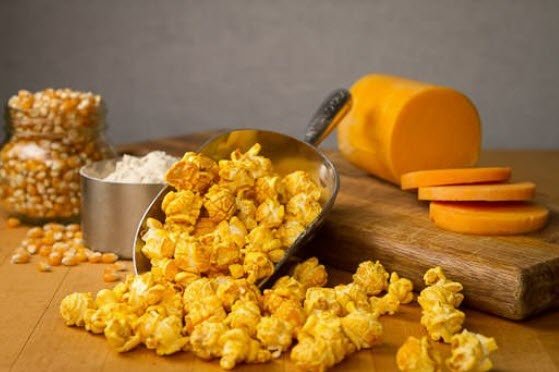 Popped popcorn, cheese, flavoring and popcorn kernals