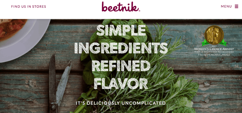 Beetnik website screenshot showing greens on a table, along with the phrase 'Simple Ingredients Refined Flavor'