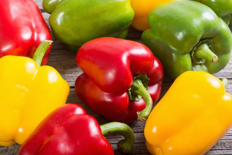 A selection of green, yellow and red bell peppers