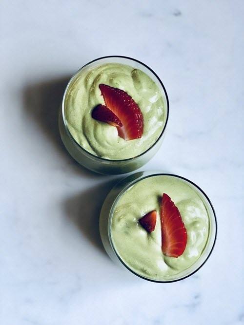 Berry-Avocado Smoothie | Food For Net Top down image of two glasses that are filled with a light green smoothie