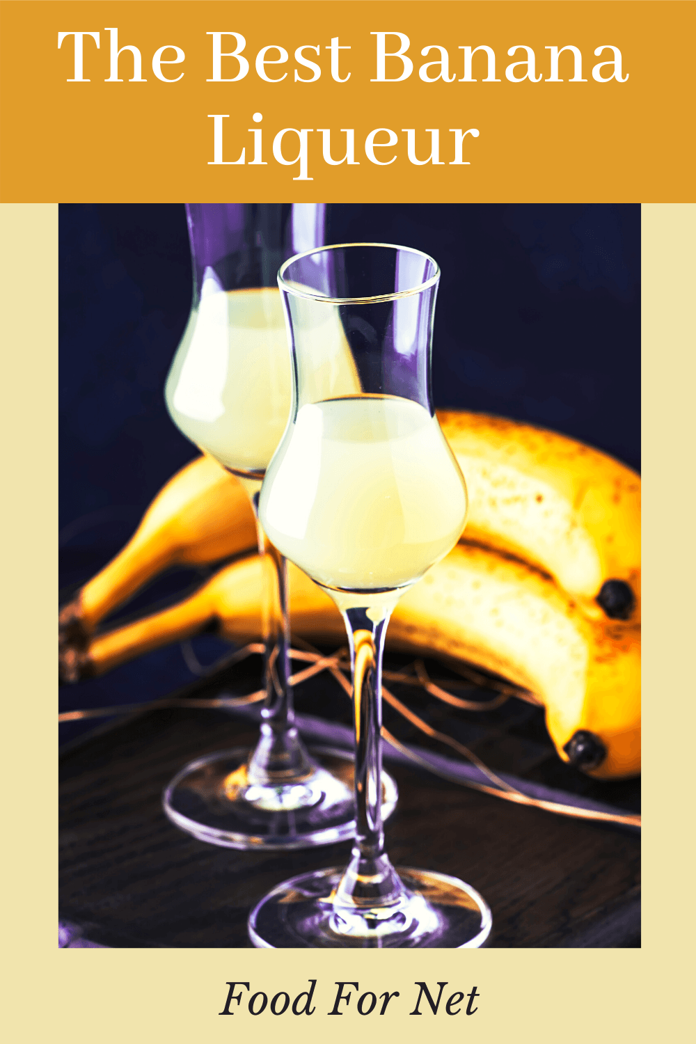 Two glasses of banana liqueur in front of bananas