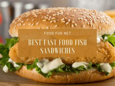 A fast food fish sandwich on a wooden table or board