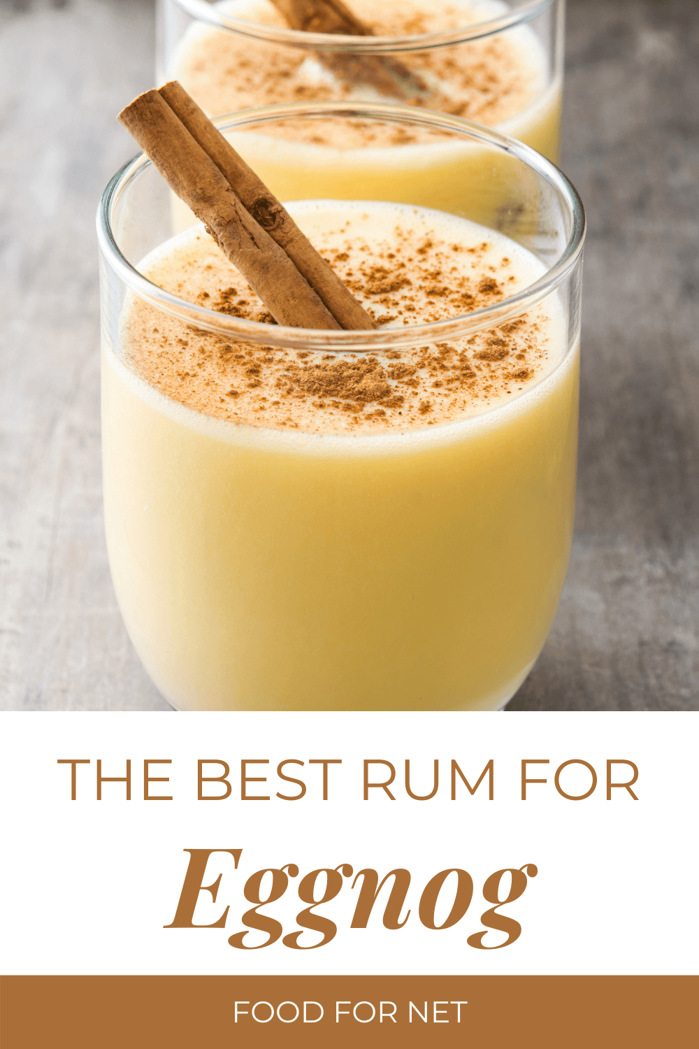 Best Rum For Eggnog. A glass of eggnog on a table with a cinnamon stick and cinnamon