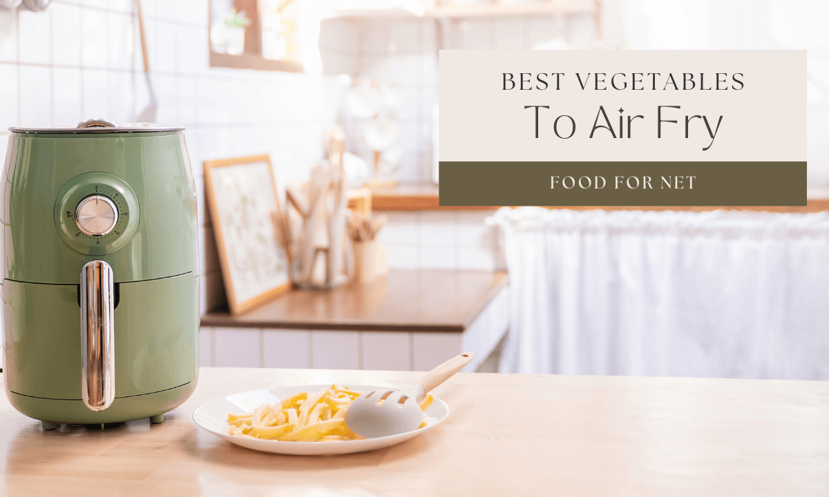 An air fryer on a counter, with potato fries, highlighting the best vegetables to air fry