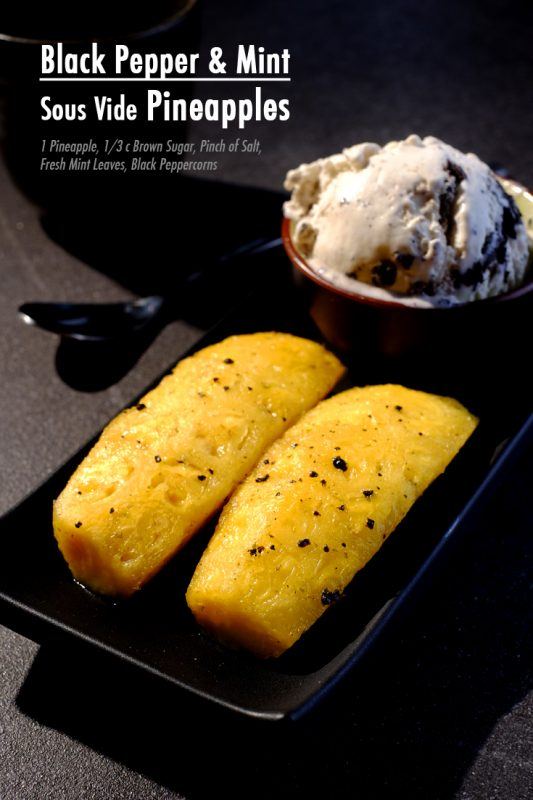 A black plate with two pieces of pineapple and a red mug containing an ice cream based dessert. 
