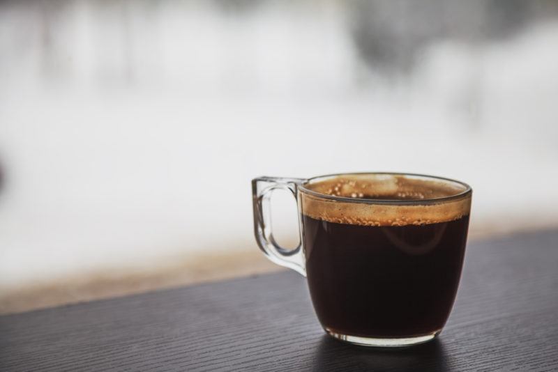 Black coffee in a glass mug