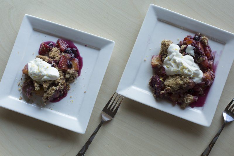 Blueberry Peach Crumble Vanilla Bean Whipped Ricotta Two Servings Forks Square Plates Cream