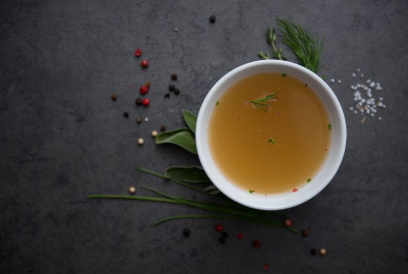 A white bowl of bone broth