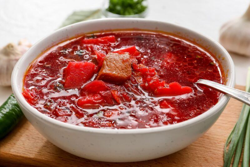 a while bowl full of borscht, national soup of Ukraine 