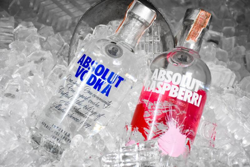 Bottles of Absolut vodka and Absolut raspberries in ice