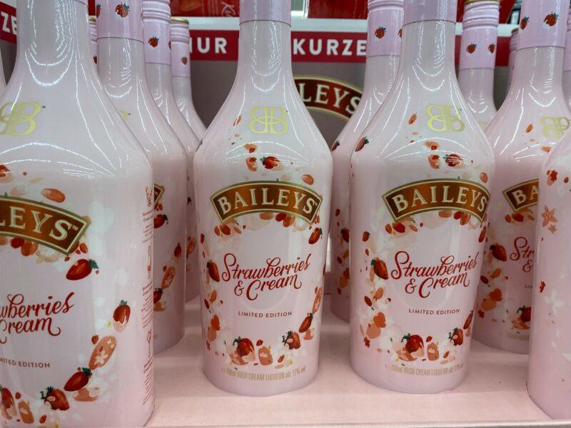 Various bottles of Baileys Strawberries and Cream on a grocery store shelf