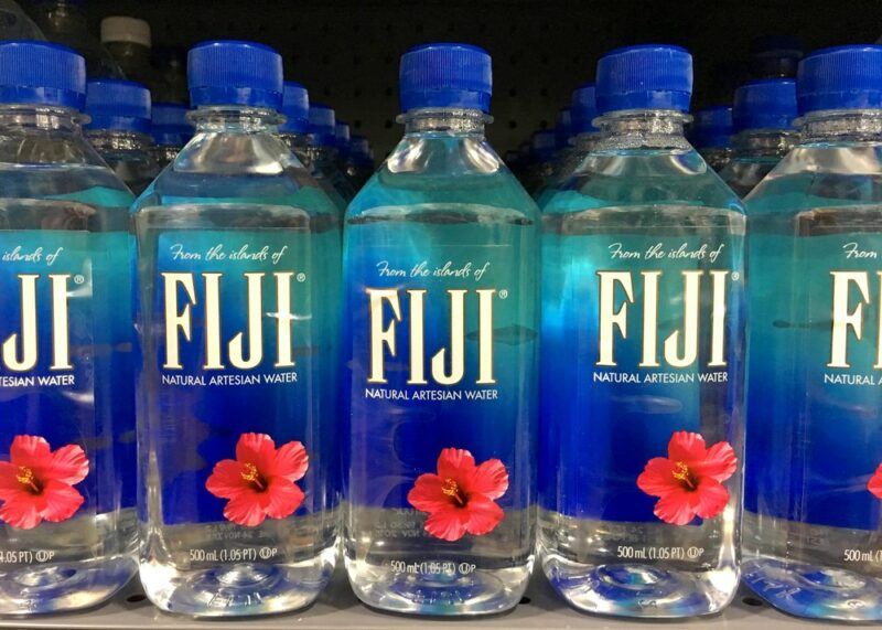 Fiji mineral water bottles on a grocery store shelf