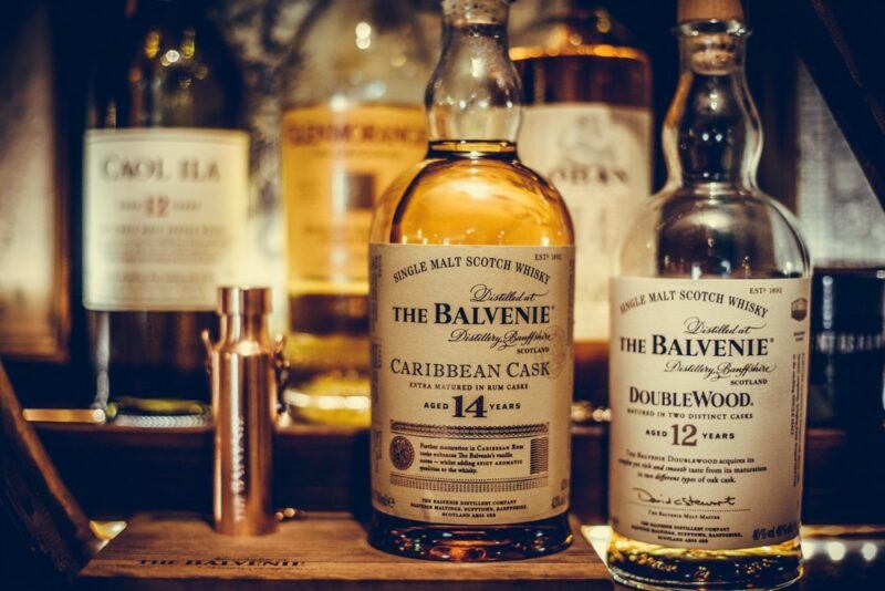 Bottles of The Balvenie whisky on a wooden stand