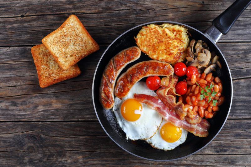 A breakfast fry up with sausages, eggs and the like