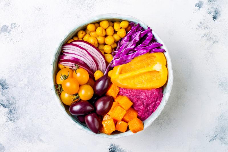 A bowl of purple and orange ingredients