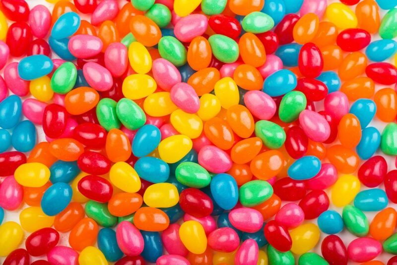 A pile of brightly colored jellybeans that use artificial colors