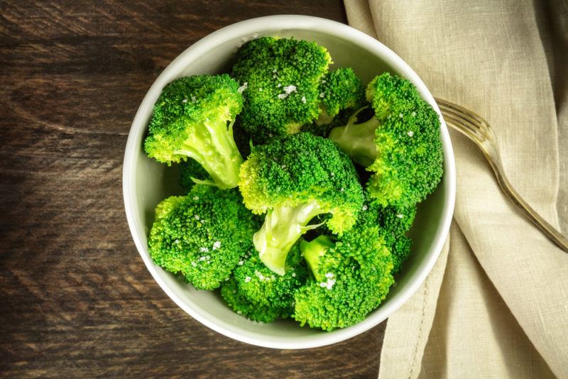 A white bowl containing broccoli