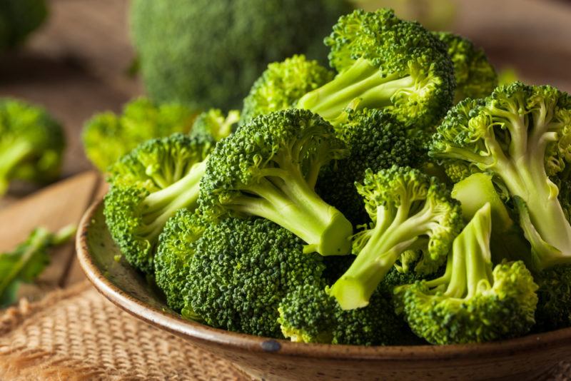 A dish containing cooked broccoli heads