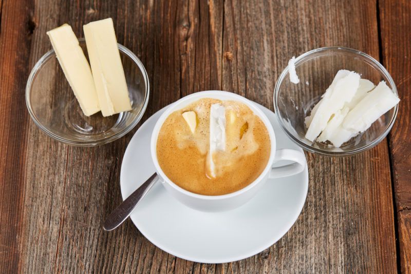 A top down image of bulletproof coffee, butter and coconut oil