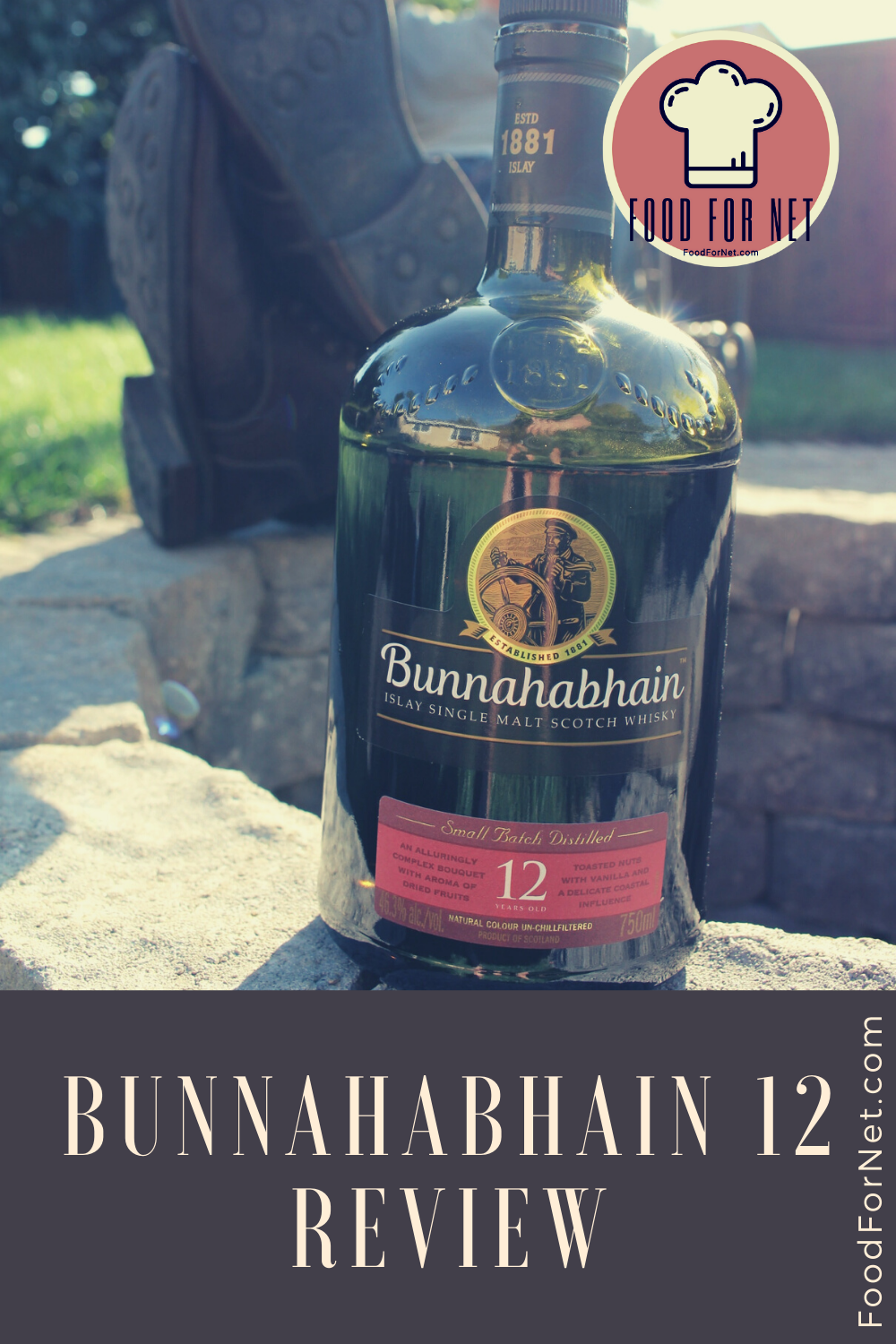 Bunnahabhain 12 bottle sitting on fire pit edge with boots in the background