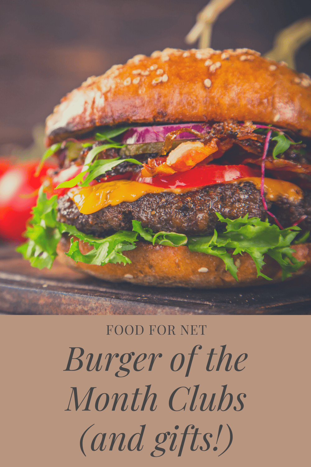 A juicy burger with lettuce, cheese and meat on a wooden table