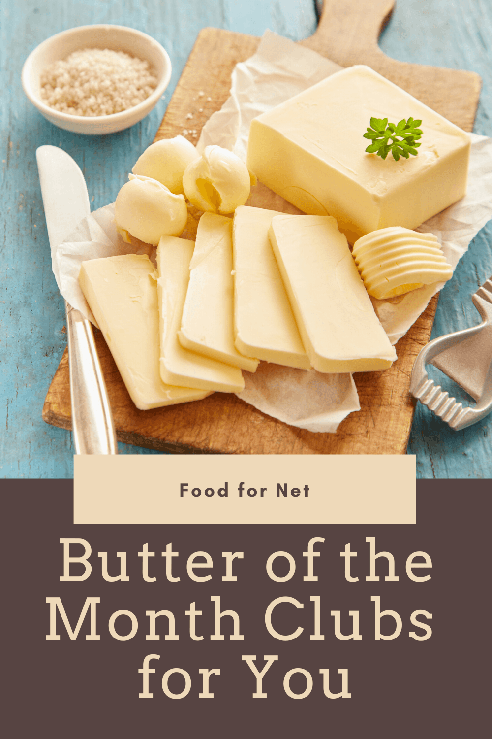 A selection of butter on a cutting board, including a block, sliced butter and butter curls