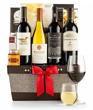 California Wine Quartet | Food For Net A basket containing 4 bottles of wine and a couple of wine glasses