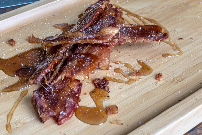 Candied bacon on a cutting board