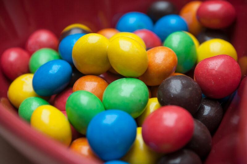 This photo shows a closeup of candy-coated chocolates.