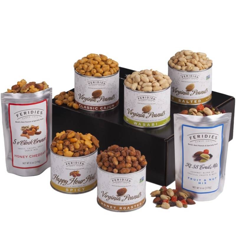 Variety of open canisters and bags of different peanut flavors like - Honey cheddar, spicy, honey roasted, classic Cajun, wasabi, Salted three canisters are sitting on a black box