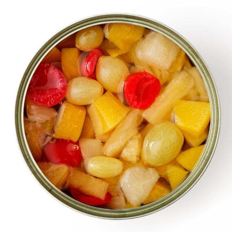 Open,Can,Of,Fruit,Cocktail,Isolated,On,White,From,Above. | Food For Net This photo shows an overhead view of an open can of fruit cocktail.