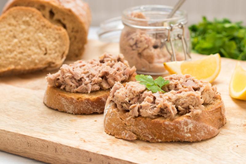 Slices of crusty bread with tuna from a can