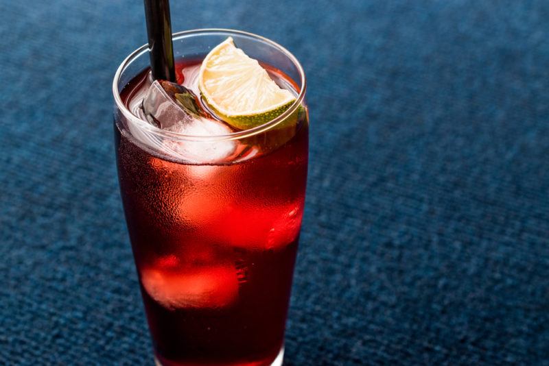 A cape codder cocktail on a blue surface