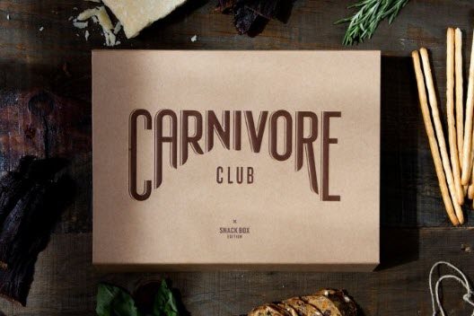 A Carnivore Club box on a wooden table