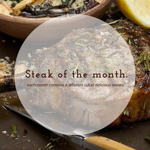 An image of cooked steak and a knife, on top of a black table