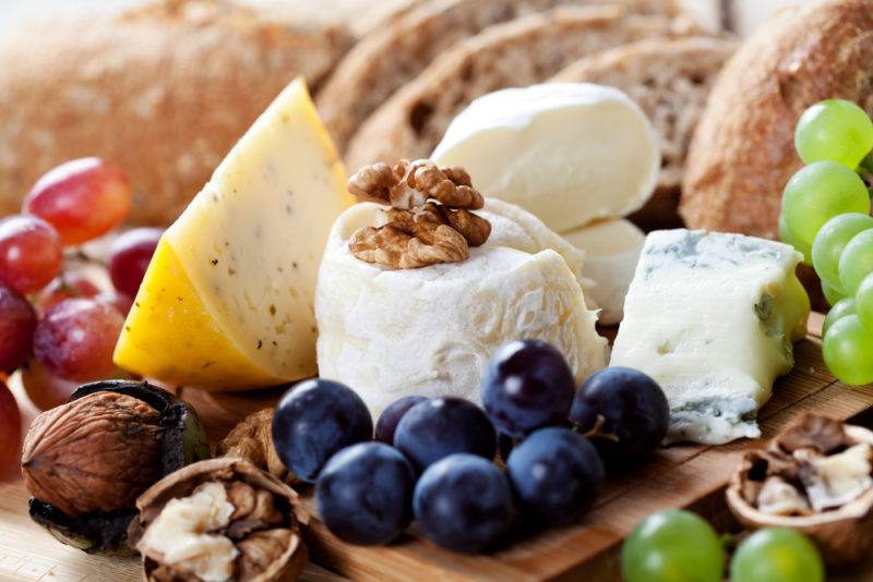 A selection of cheeses, nuts and fruits