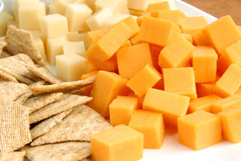 Cubes of two types of cheese and some crackers