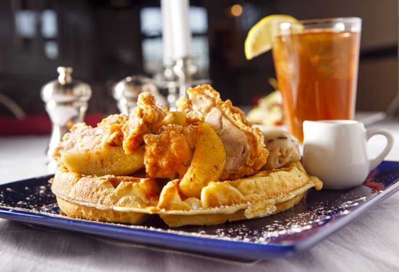 A plate full of chicken and waffles