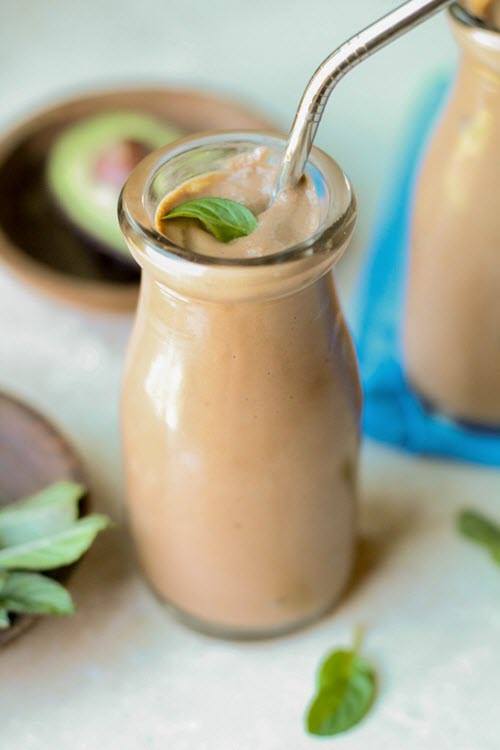 A creamy chocolate shake in a milk bottle-style bottle. 