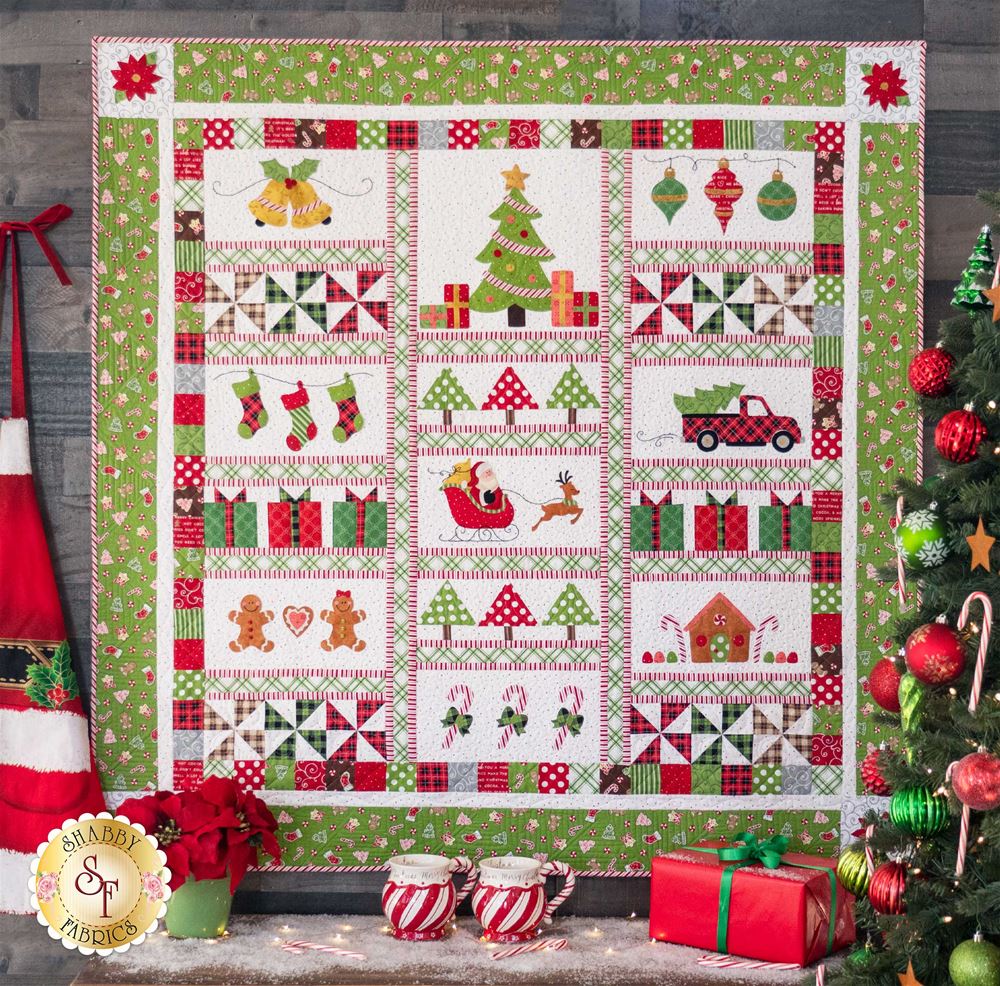 Christmas quilt with christmas decorations around and in the background