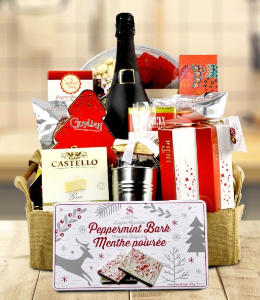 Christmas Snacking Basket | Food For Net Light colored basket with various red and white themed gifts