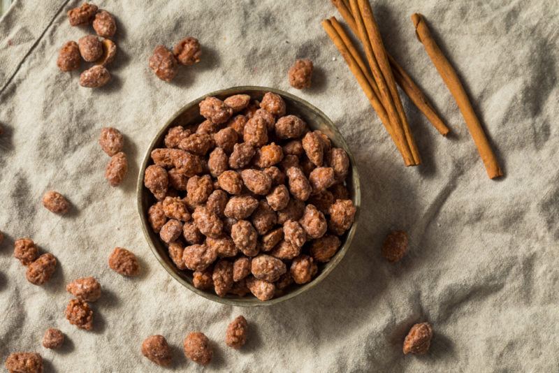 A bowl of almonds coated with cinnamon sugar