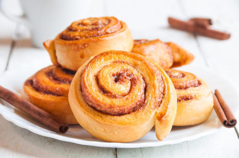 Fresh cinnamon rolls on a white plate